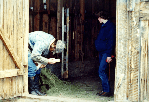 Sublette County rancher Albert Sommers bottle feeds a calf during calving season in Wyoming.