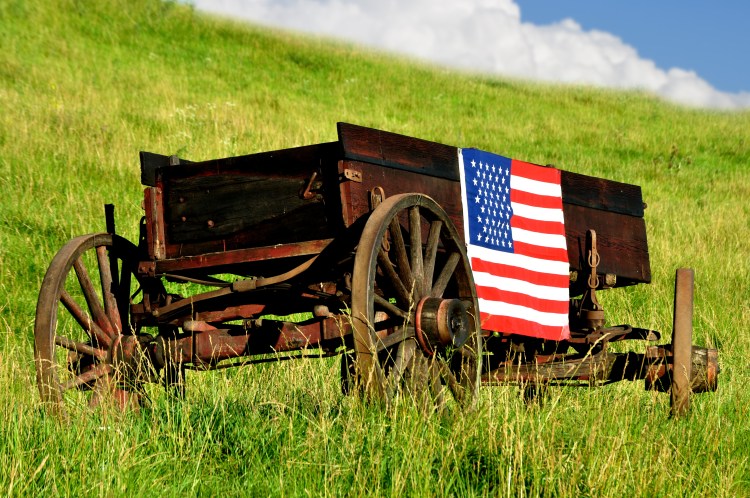 American flag on buckboard wagon