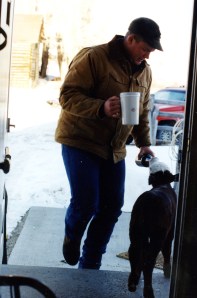 Sommers Ranch employee Brian Esterholt gives bum calf Gertie a drink before going out to play.
